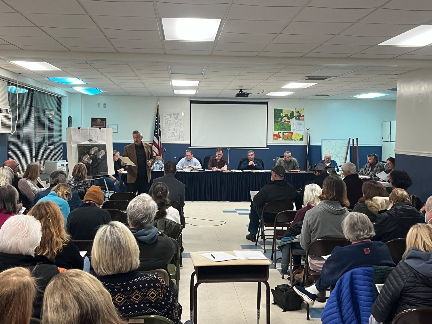 Concerned residents filled the Town of Bethel Planning Board meeting for a recent public hearing regarding a new hotel proposed for the site of the White Lake Mansion House.