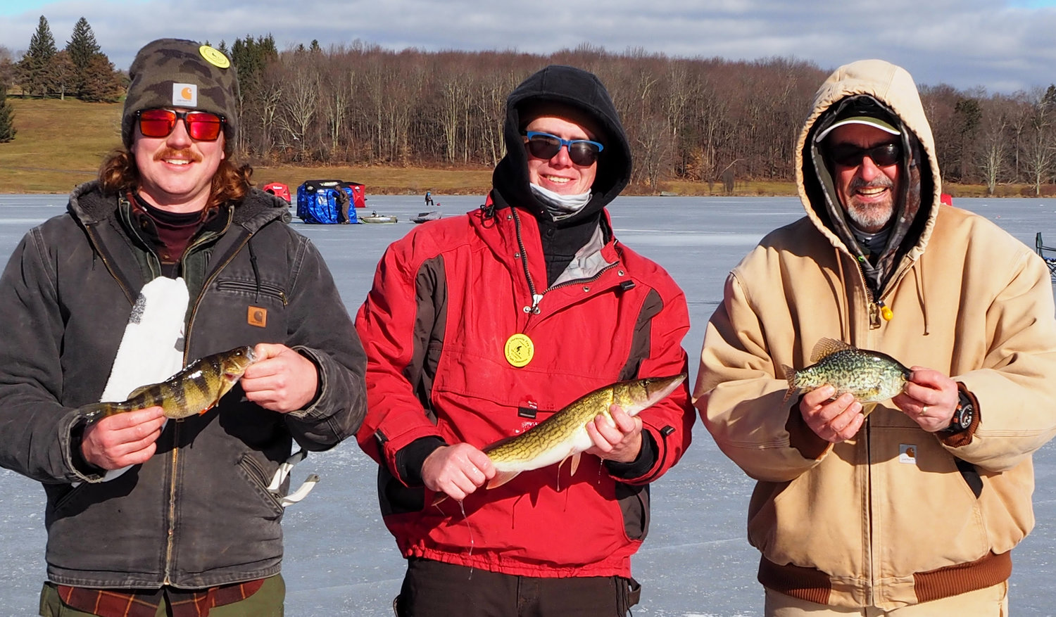From left to right, Austin Halchak holding his second-place perch, Caleb Todd with his winning pickerel and Mike Lauri with a fine crappie.