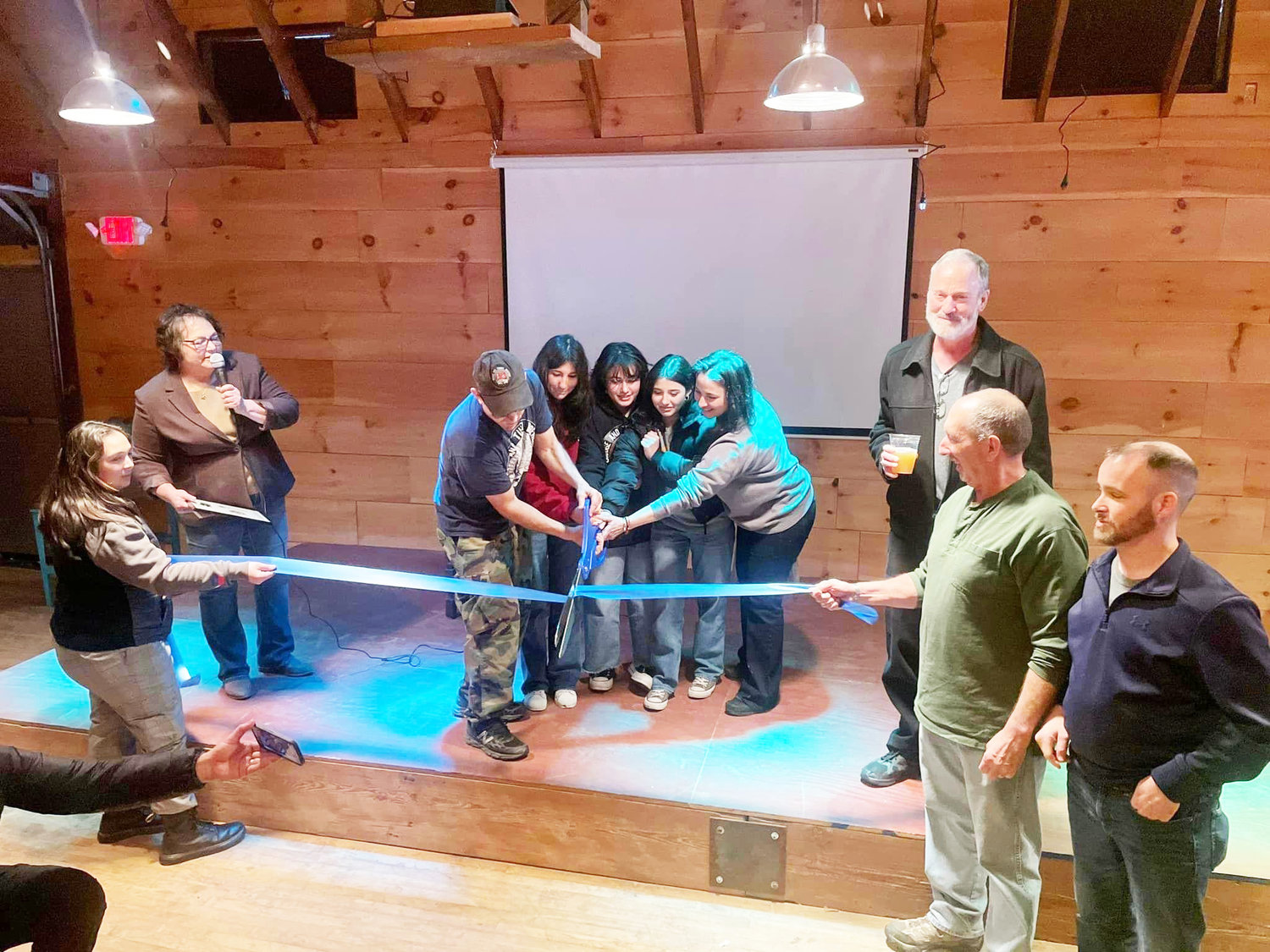 Cutting the ribbon is Bridge and Tunnel Brewery owner Rich Castagna, his wife Lisa and daughters Mia, Hailey and Sammy.  To the left is Sullivan County Chamber of Commerce Ambassador Shayna Benskie (holding ribbon) and President/CEO Jaime Schmeiser. To the right, from left, is Town of Liberty Councilman Dean Farrand, Supervisor Frank DeMayo and Councilman Brian McPhillips.