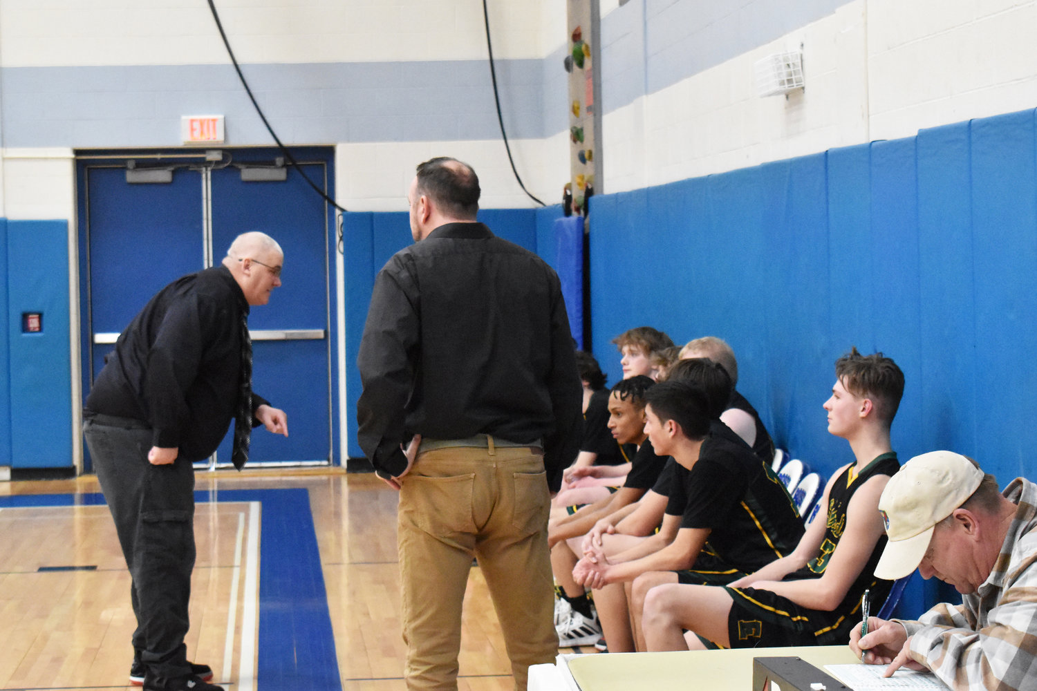 Coach Furler addresses his team after their Sectional tournament loss to Roscoe, explaining to them how successful their season was and urging them not to hang their heads.