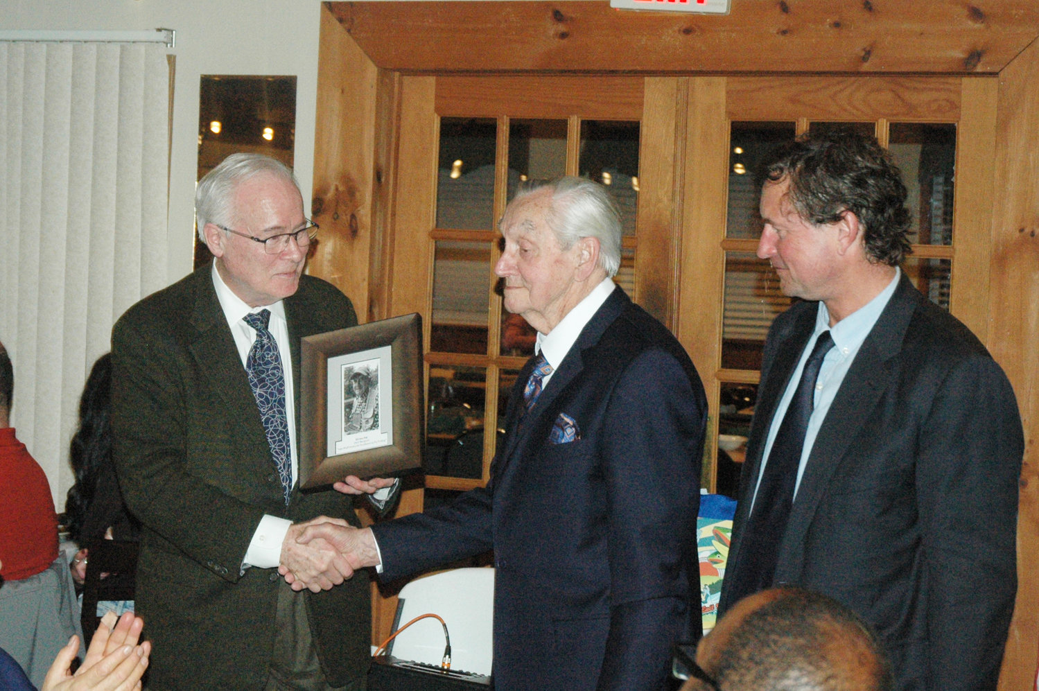Ed Van Put accepts first ever “Joan Wulff Award for Fly Fishing Excellence” at 62nd Annual Two Headed Trout Dinner. From left to right, Richard Schager, Ed Van Put and Ramsay Adams.