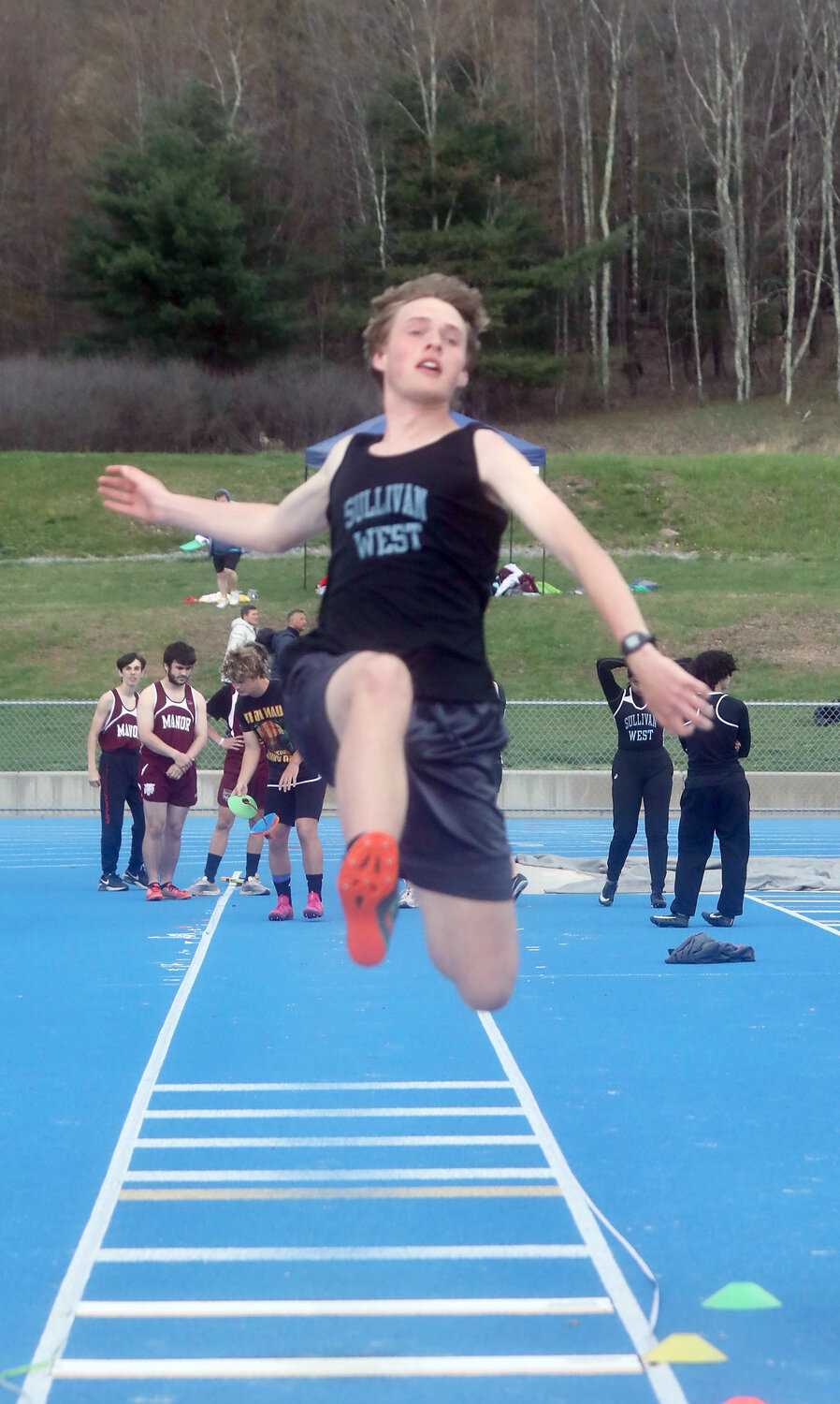 Sullivan West’s Hunter Ebeling wins the long jump with a leap of 17-11.