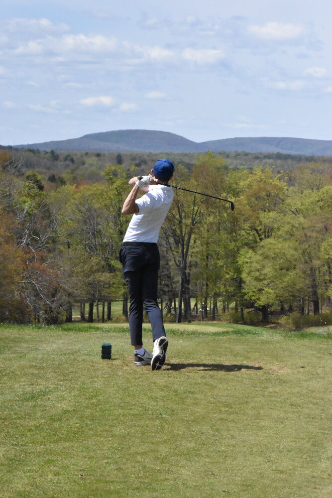 Monticello’s Joseph Russo drives off the tee box of the first hole on the Tarry Brae course. Russo shot a 46 on Monday during the divisional matchup.