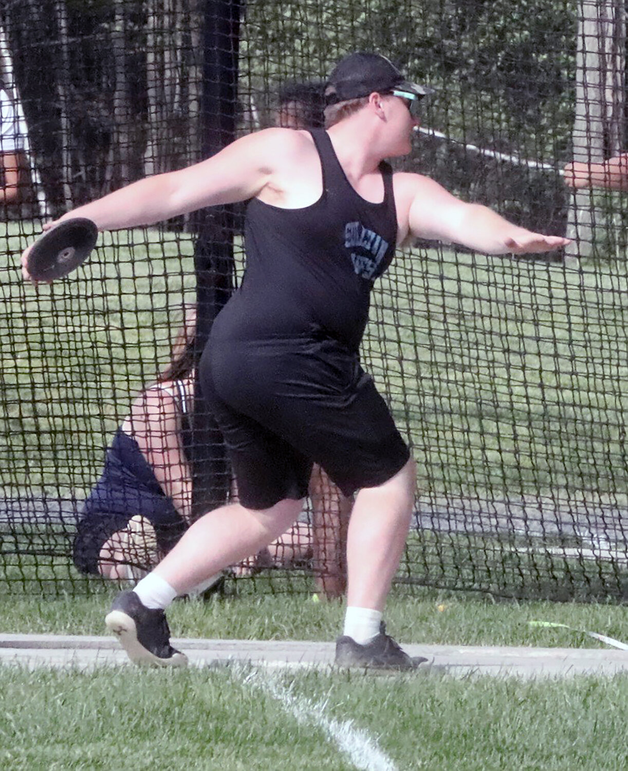 Sullivan West’s Dillan Hanslmaier goes into the spin prior to releasing the discus. He took fifth in the event and finished 10th overall among the 33 boy throwers.