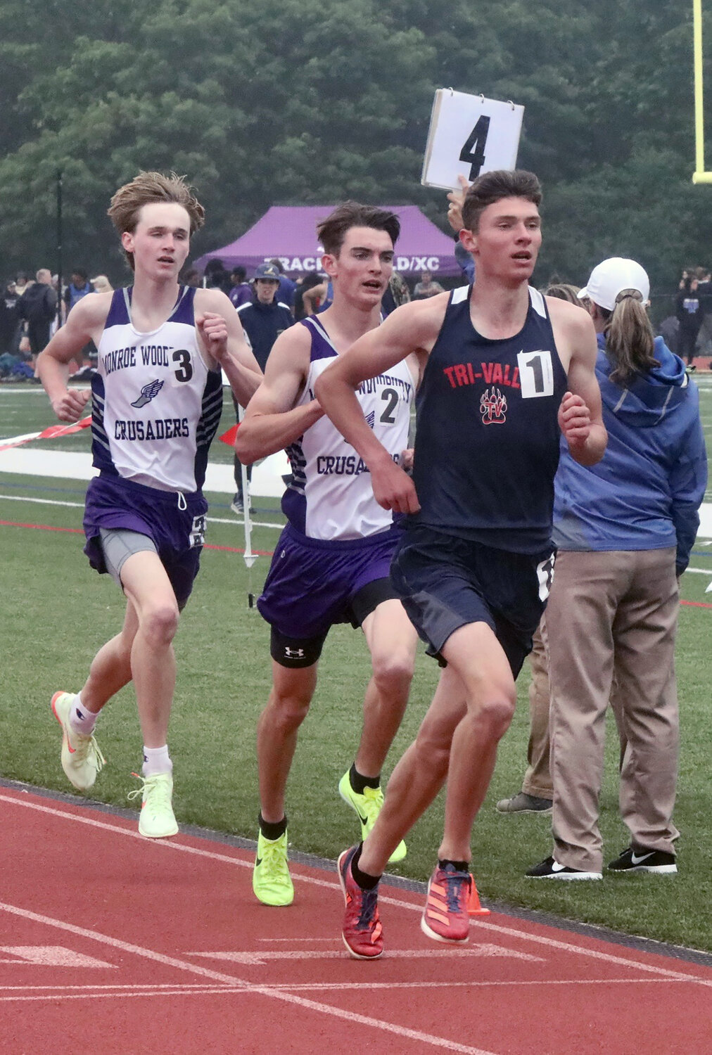 Tri-Valley senior Adam Furman holds a slight lead over Monroe-Woodbury’s Colin Gilstrap and Colin Catherwood. The duo passed him despite his turning in a time less than one second shy of his school record. He came back to beat them both in the 1600.