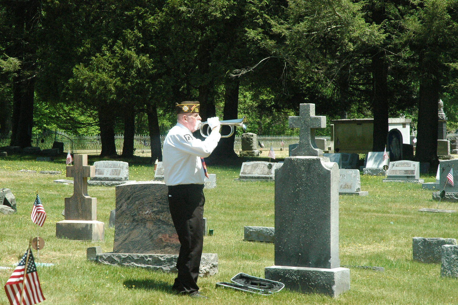 Marine veteran Robert Lepple performs Taps on his bugle in the Long Eddy Cemetery to honor those who made the ultimate sacrifice in service of our country.