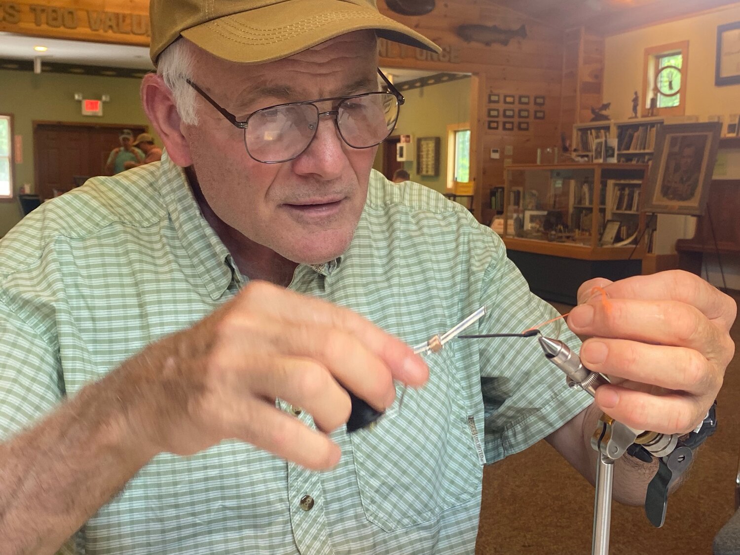 John Apgar tying a Lightning Bug fly at the recent tying meeting of the Catskill Fly Tyers Guild held at the  Wulff Gallery at the CFFC.