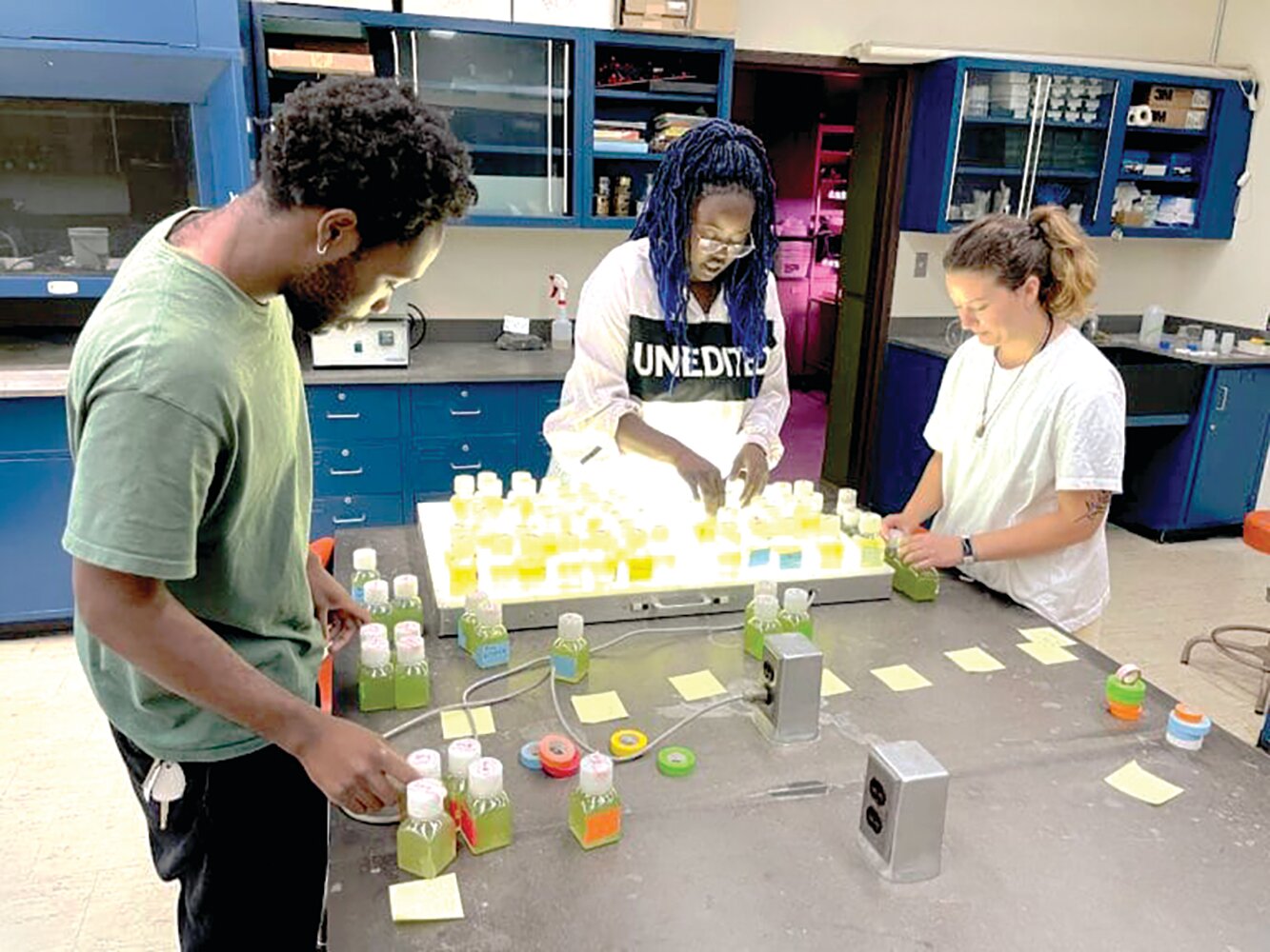 SUNY Sullivan Student Dominique Etienne (Center) 
conducted research this past summer.