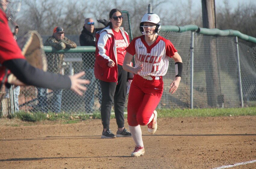 Senior Lexie Dulaban rounds third and heads home during the Lincoln softball game against Tipton Wednesday night in Tipton. Dulaban reached base all four times she batted.


Photo by Jack Denebeim | Democrat
