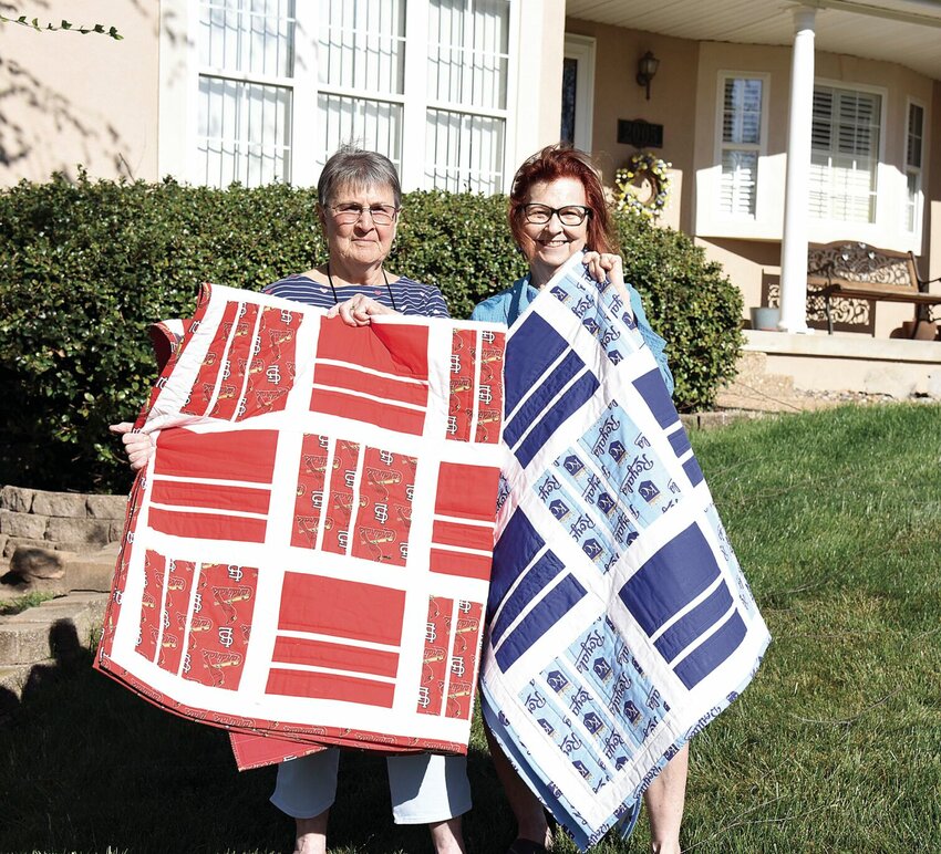On Wednesday, April 17, Sedalia Literacy Council member Noreen Loveall, left, and Chair Betty Albrecht hold two handmade quilts that will be featured in the 22nd annual Literacy Council Tea and Auction on Sunday, April 21.


Photo by Faith Bemiss-McKinney | Democrat