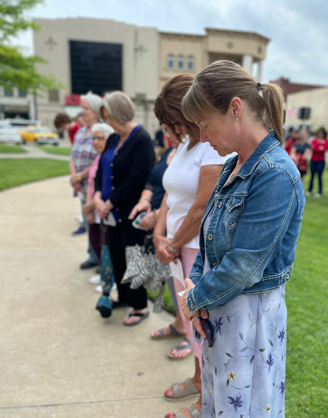 Kim Lyne and a group of Pettis County employees join others for the National Day of Prayer observance Thursday, May 2 at the Pettis County Courthouse.


Photo by Chris Howell | Democrat
