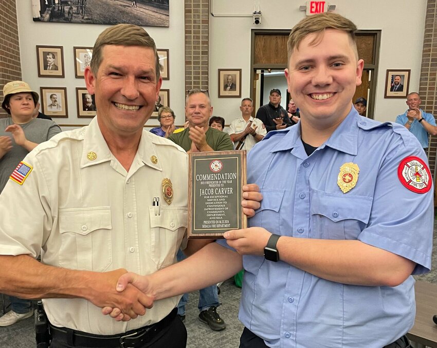 Sedalia Fire Chief Matt Irwin, left, congratulates firefighter Jacob Carver upon being named Sedalia Firefighter of the year art Monday's Sedalia City Council meeting.


Photo by Chris Howell | Democrat