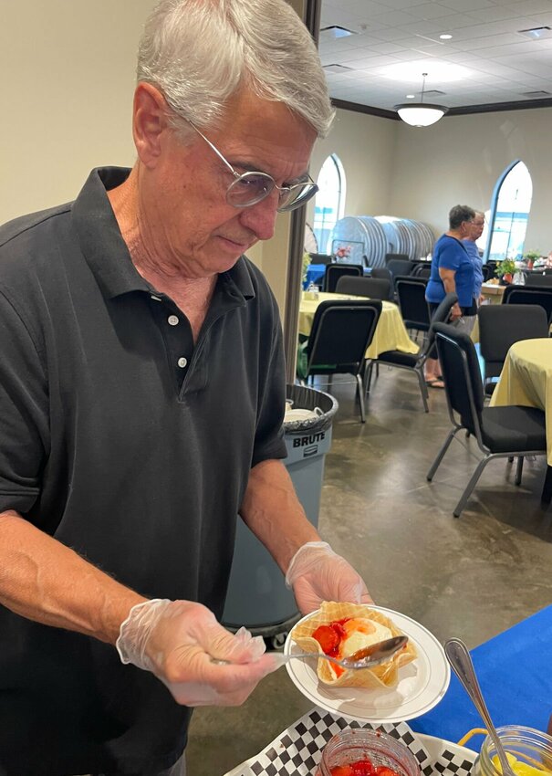Steve Hession volunteered to serve ice cream at Thursday's Pettis County Democrat Club's Ice Cream Social held at the First United Methodist Church. Hession admitted he was not a Democrat but did a good reason to attend. “Because my wife is a Democrat and I am independent,” Hession said, “and I like to make a choice.” Photo by Chris Howell | Democrat