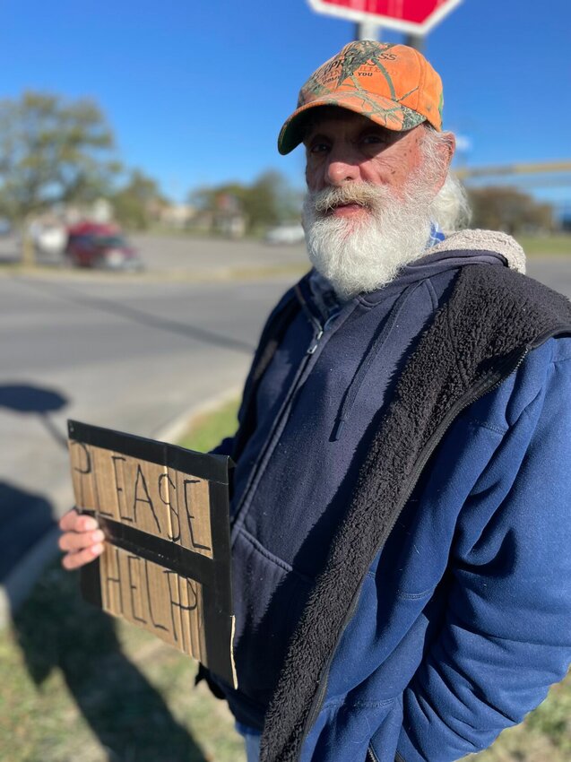 Vernon Harris has been homeless for three years and lives in his Honda. Harris stood outside of Walmart with a sign reading 'please help,' on Wednesday, Oct. 16, with hopes to raise enough money to eat and fix the heat in his car.


Photo by Chris Howell | Democrat