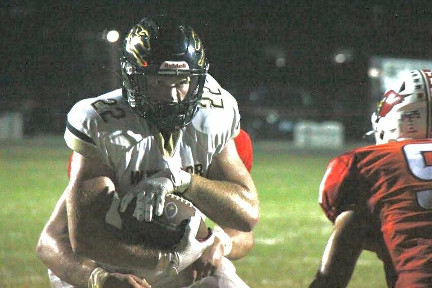 Windsor sophomore Rowan Cox protects the ball as he is met by Tipton defenders during the game on Sept. 20. Cox has 1,214 yards on 105 carries this season and 18 rushing touchdowns.


File photo by Jack Denebeim | Democrat