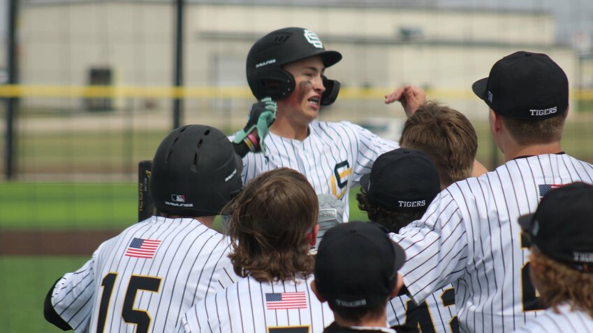 Smith-Cotton freshman Karson Wiskur, center, celebrates hitting a home run with his teammates during the game against Warrensburg on Friday, March 21, at Smith-Cotton High School.


Photo by Joe Andrews | Democrat