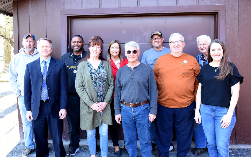 Members of Sedalia Community Helping Hands pose for a photo on Tuesday, April 8, as they celebrate the completion of their 50th home project. From left on the back row are Brice Bell, Traves Williams, Robin Balke, Ray Marquez, and Wayne Rhoads; from left on the front row are Paul Beard, Sharyn Fante-Hession, Stephen Hession, David Esser, and Stacey Beard.