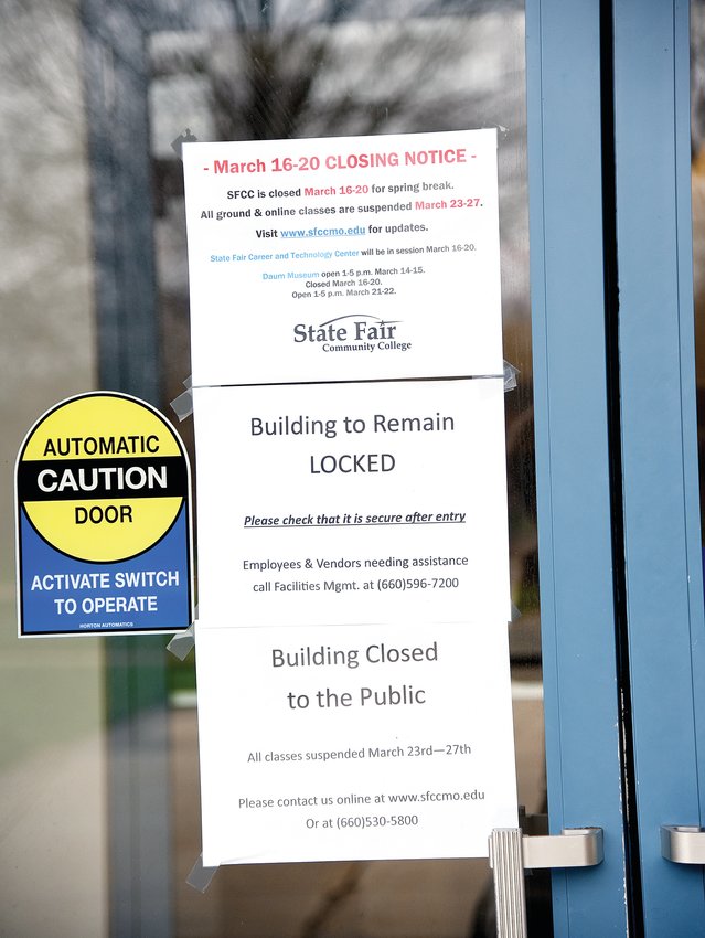 A sign posted on the doors of State Fair Community College in March 2020 talks about the closing of the College due to the COVID-19 pandemic.