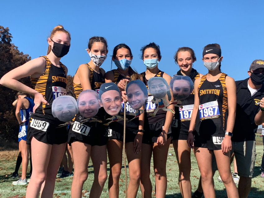 The Smithton girls cross-country runners pose for a photo before the MSHSAA Class 1 Cross-Country Championships at Gans Creek Cross Country Course in Columbia.