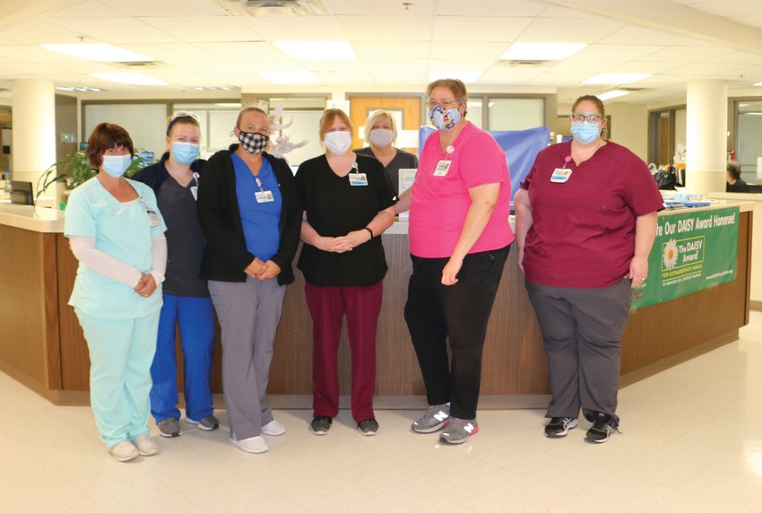 From left, Natalie Paxson, interim unit manager; Kayla Mather, RN; Angel Abbett, RN; Connie Roll, LPN; Denise Hoffman, former unit manager; Rose McMullin, chief nursing officer; and Kayla Thornton, LPN.
