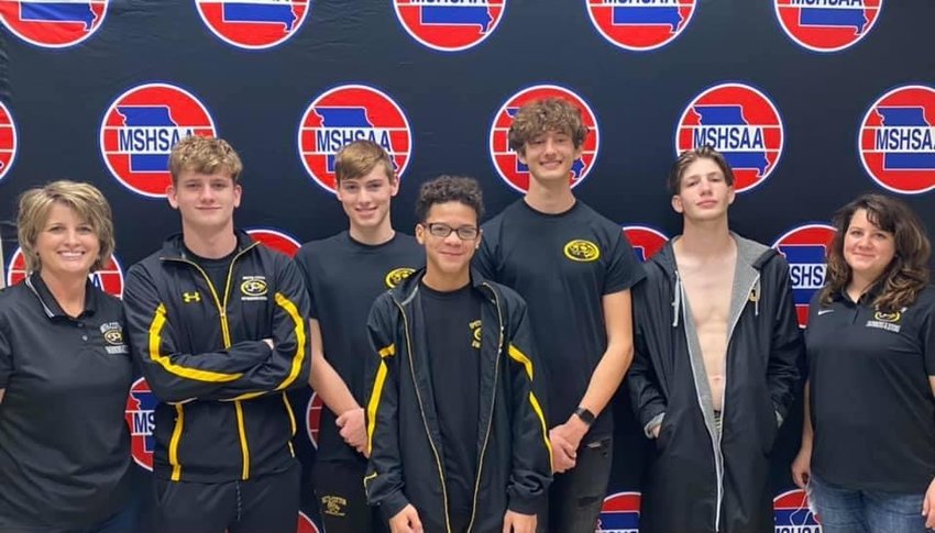 CUTLINE1: Smith-Cotton boys swim and dive poses for a photo after competing at the Class 1 MSHSAA Championships in St. Peters. Pictured, from left, are S-C swim and dive head coach Michelle Steger, sophomore Clay Pilliard, senior Hunter Scholl, freshman Julius Washington, senior Lowell Pilliard, junior Justice McDonald and assistant coach Victoria Linderman.
