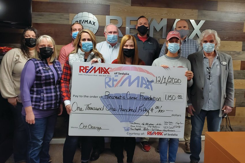 RE/MAX of Sedalia recently donated $1,150 to the Pancreatic Cancer Foundation through its Heart of Sedalia Foundation. Each month, the agents donate a portion of their earnings from every transaction to help support various local charities. Pictured are Dave Wiedeman, Ryan Wiedeman, Megan Grimm, Robert Ekstrom, Nicci Ragsdale, Dennis Hagen, Misty Inlow, Ashlee Martin. Kyscha Martin, and Gage Saulbeamer.