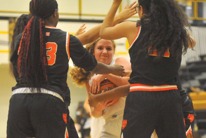 Lady Tigers freshman Hailey Burlingame fights for possession Tuesday during a 51-12 loss to Waynesville at Smith-Cotton High School in Sedalia.