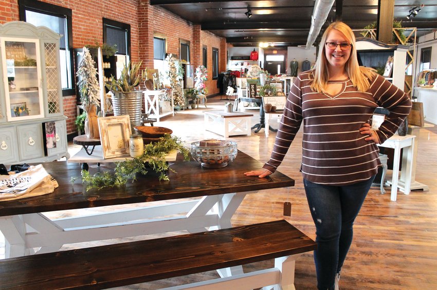 Allison Goodman, of Houstonia, stands at the front of her new business, Southern Maven Boutique, on Monday afternoon. The shop is located on the second floor of Lamy&rsquo;s.