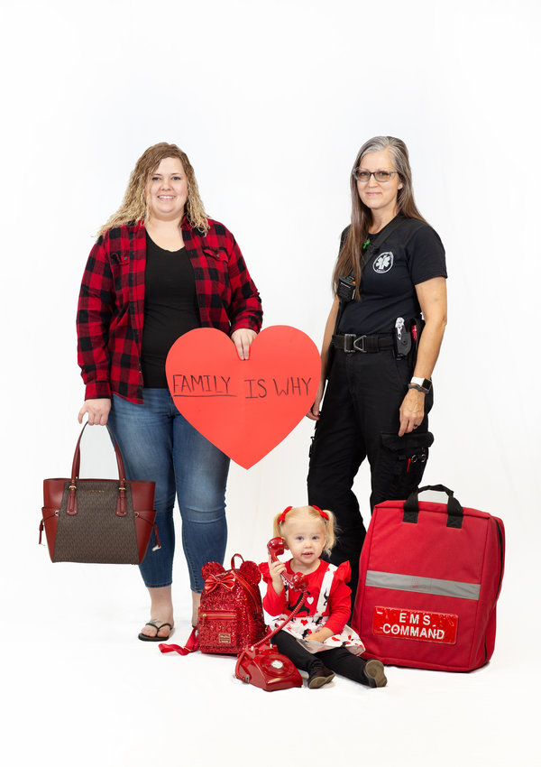 From left, Tina Plain, Pettis County Ambulance District (PCAD) EMT-B, and her daughter, Ava Plain, and Charisse Bauer, PCAD EMT, showcase purses available for purchase at the 2021 Wear Red for Women auction along with an automated external defibrillator (AED). Proceeds from this year&rsquo;s event will be used to purchase additional AEDs for public places in the community. To reserve tickets, visit www.brhc.org/2021wearred.