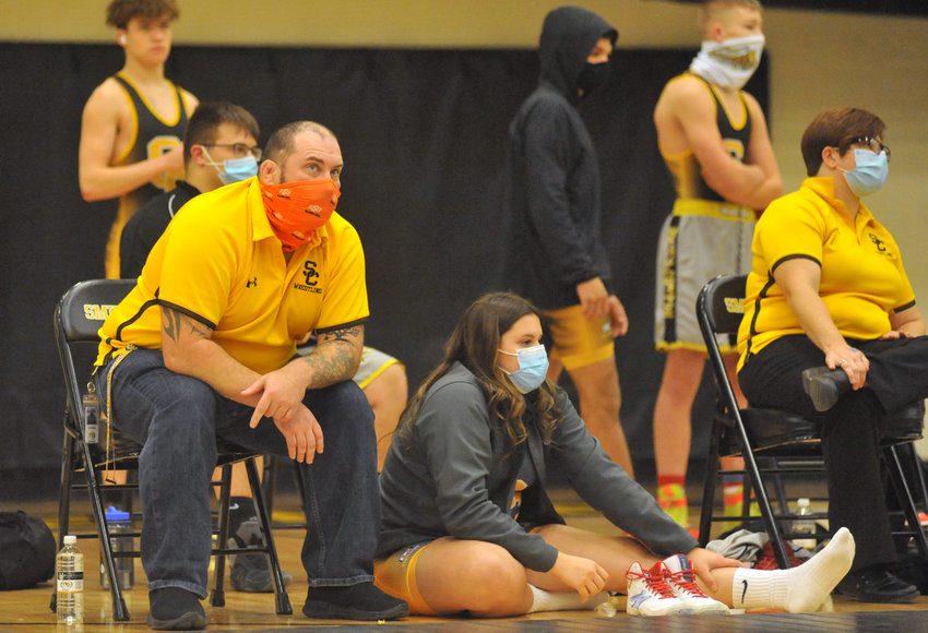 Smith-Cotton wrestling head coach Joe Hulsey, left, and Lady Tigers senior Kali Butts follow a match Jan. 14 during a dual with Rock Bridge in Sedalia.