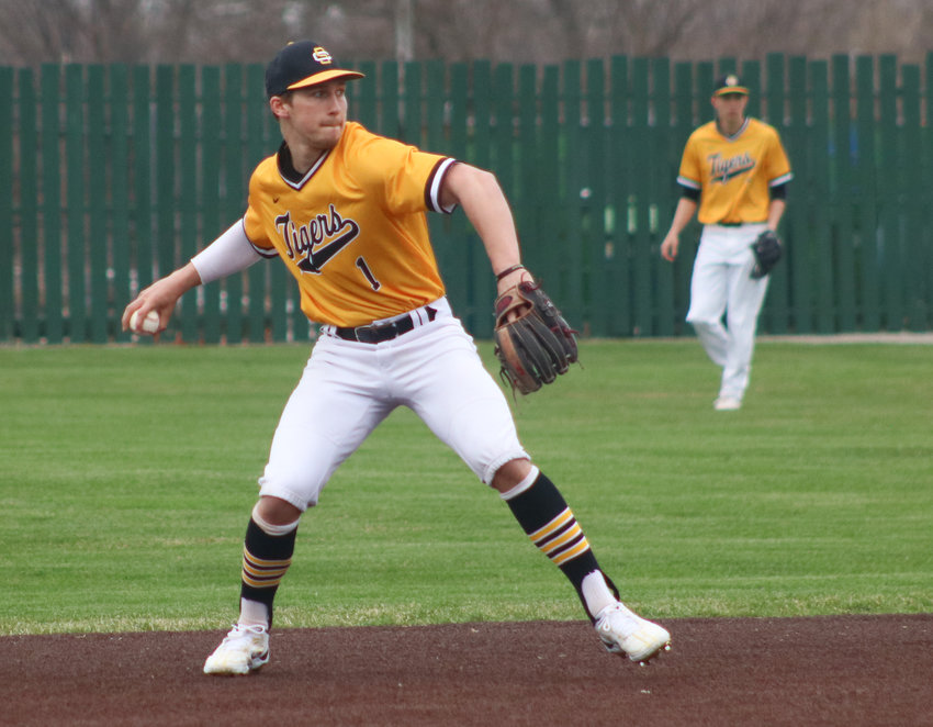 Smith-Cotton senior shortstop Adam Webb throws across the diamond for an out in the first inning of the Tigers&rsquo; Central Missouri Activities Conference game against Rock Bridge Monday afternoon at Liberty Park Stadium.