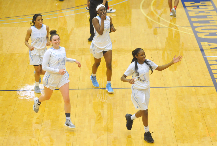 State Fair Community College players run to the bench Thursday to celebrate a 67-61 victory over Jefferson College at the Fred E. Davis Multipurpose Center in Sedalia.