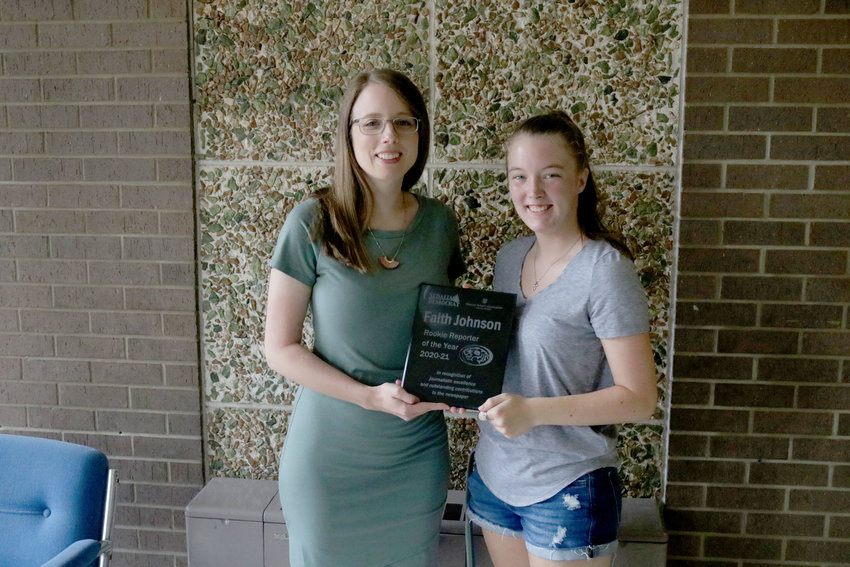 Sedalia Democrat Editor Nicole Cooke, left, presents Faith Johnson with the Sedalia Democrat Rookie Reporter of the Year for her work as a student reporter with the Tiger Times, S-C&rsquo;s student newspaper. Johnson recently graduated from Smith-Cotton High School.