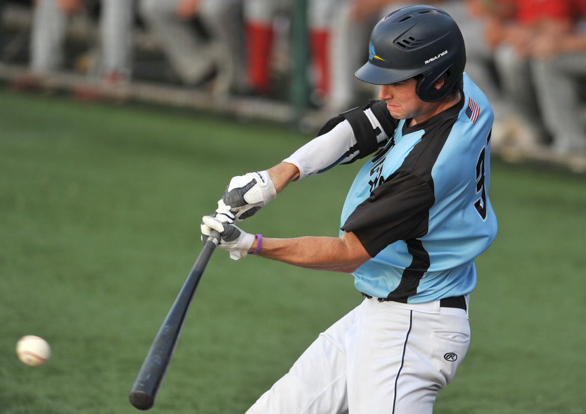 Sedalia Bombers shortstop Brandon Stahlman connects with a pitch Friday during a game against the St. Joseph Mustangs at Liberty Park Stadium in Sedalia.