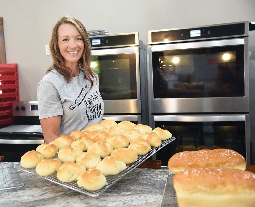 Tonya Nelson, of Cole Camp, holds a tray of her freshly baked rolls just as her late grandmother Evelyn Goosen did in a 1997 Democrat food article. Nelson, who owns Tonya&rsquo;s Rustic Kitchen LLC, learned to bake from her grandmother and is carrying on her yeast bread traditions.&nbsp;