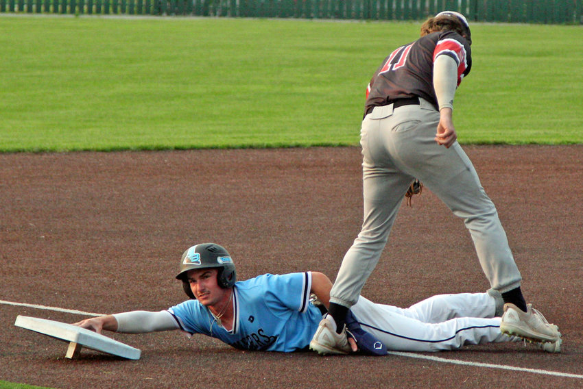Sedalia Bombers second baseman Kellen Williamson completes a steal of third base Tuesday during an 8-3 victory over the Joplin Outlaws at Liberty Park Stadium in Sedalia.