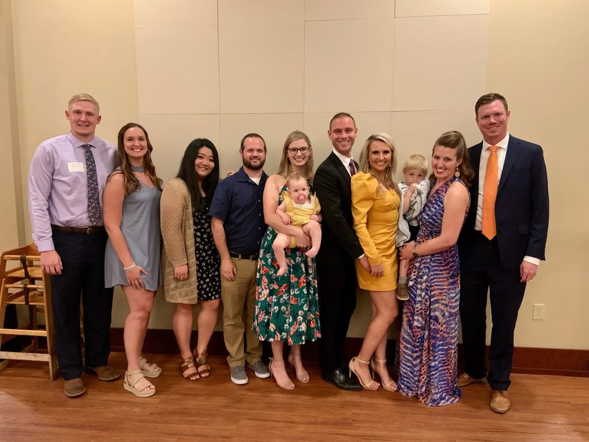 Several new physicians have joined or will join the Bothwell Regional Health Center medical team, with the new Bothwell-University of Missouri Rural Family Medicine Residency being a leading reason for them to choose Bothwell. Shown here with their spouses and family following their recent residency graduation program are from left, Dr. Dalton Lohsandt (projected to arrive in 2022 or 2023) and Kelly Lohsandt; Ellie Euer, residency program coordinator; Eddie Emery and Dr. Alyssa Emery (holding Lucy Emery); Greg Djinis and Dr. Lisa Wadowski; and Dr. Misty Todd (holding Gabe Emery) and Dr. Matthew Roehrs.