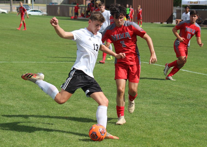 Smith-Cotton defender Ein Martin clears a ball out of the box in the opening half of the Tigers' game against Nixa in last weekend's Kickapoo Tournament.