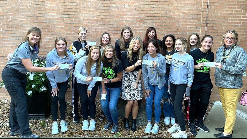A group photo was taken outside of Heber Hunt Thursday morning when the Smith-Cotton Girls Soccer team donated checks to all the elementary school counselors.   Front row from left to right: Parkview Counselor Virginia Sparks, Rilee Jackson, Lindsey Davis, Heber Hunt Counselor Amanda Jackson, Skyline Counselor Meagan Klein, Adamaris Ramirez, Adelaide Vannatta, Maria Decker, and Horace Mann Counselor Amy Dunkin.  Back row from left to right: Hayleigh Snyder, Washington Counselor Michelle Hofstetter, Head Coach Meredith Brick, Sarah Shireman, Emily Ramirez, Kennedy Woolery.