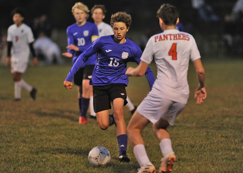 Green Ridge sophomore Weston Crawford looks to get past a defender in Tuesday night&rsquo;s match against Knob Noster.