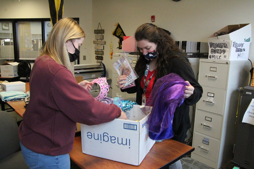 National Honor Society Advisor Dr. Lorin Blackburn Thierfelder and NHS member Jacquelyn Fairfax go through items that have been donated by NHS members Tuesday morning at Smith-Cotton High School.