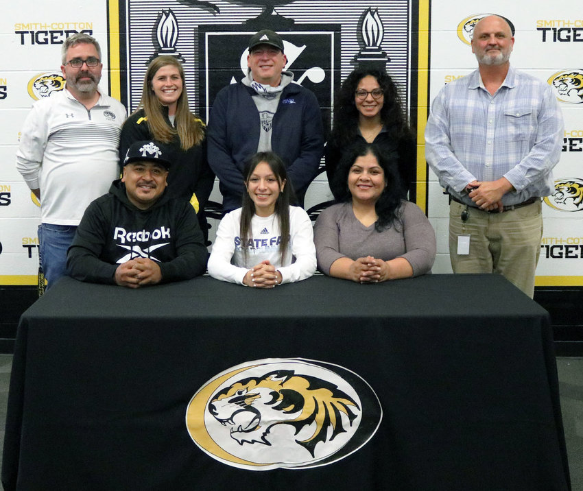 Smith-Cotton High School senior Adamaris Ramirez has signed a letter of intent to play soccer at State Fair Community College in Sedalia. Seated with her are her parents, Edgar and Claudia Ramirez; back, from left: S-C Principal Wade Norton, S-C Girls Soccer Head Coach Meredith Brick, SFCC Women&rsquo;s Soccer Head Coach Jaime Beltran, sister Emily Ramirez, and S-C Athletic Director Rob Davis.