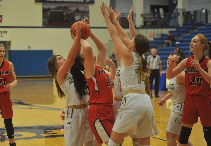 Three Windsor players try to trap Chilhowee&rsquo;s Jill Skidmore in Friday night&rsquo;s game at State Fair Community College.