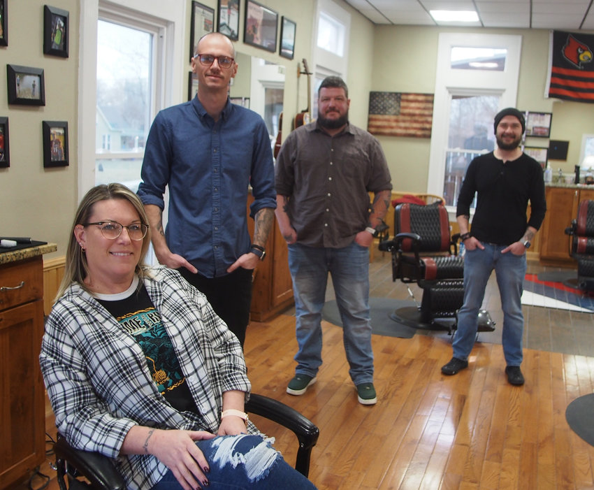 Stephanie Flick, Jason Joy, Joshua Hesse and Rory Colburn opened The Missouri Barber Company on Tuesday. Wednesday, the barbers are seen enjoying their new business.