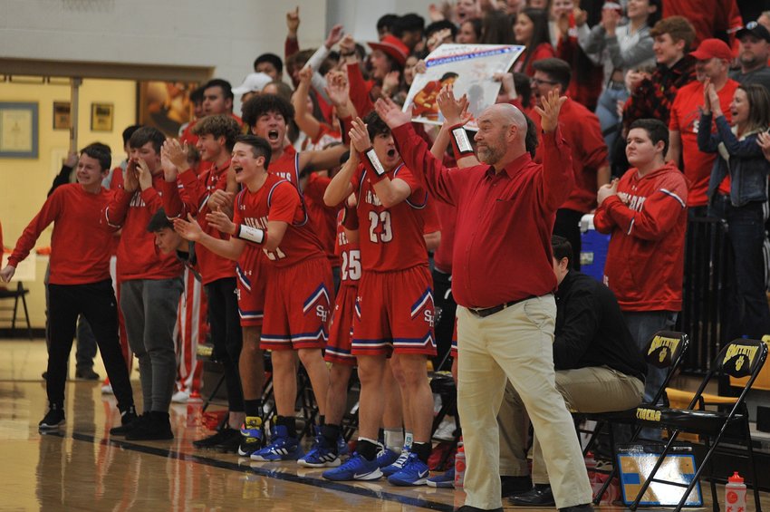 Sacred Heart head coach Steve Goodwin and the Gremlins&rsquo; bench gets alive in front of the crowd in last weekend&rsquo;s district championship victory in Smithton. Only Saturday&rsquo;s game separates the program from another Final Four appearance.