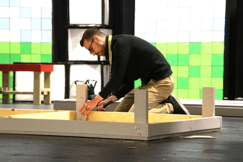 Theater and Speech teacher Rylan Swank builds a set at Smith-Cotton Junior High for a musical that will premiere April 7 and 8. Swank has worked for the Sedalia School District 200 for eight years.