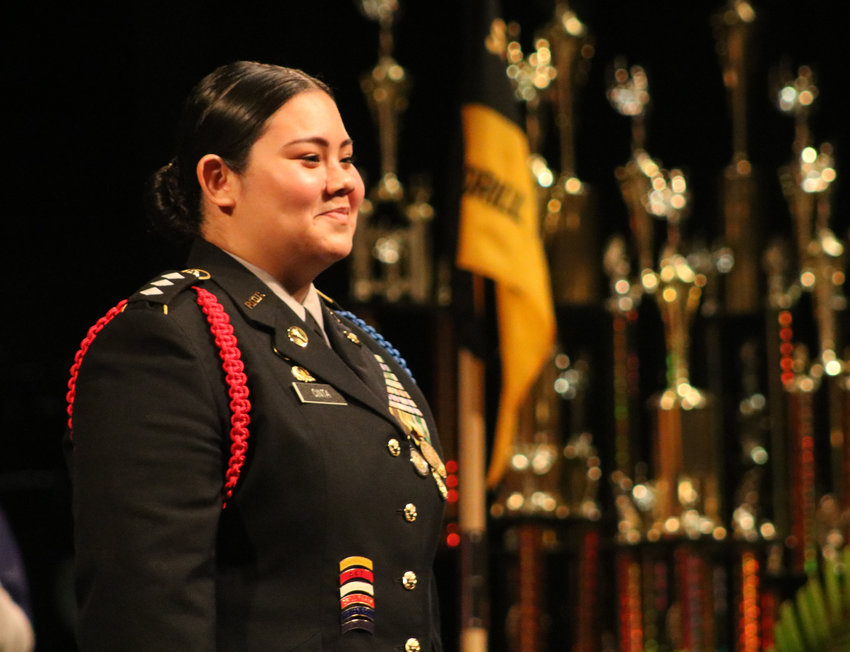 Luisa Cinta-Castillo receives an ovation from cadets and families as she is presented as the commanding officer of the Smith-Cotton High JROTC Tiger Battalion for the 2022-23 school year during the program&rsquo;s awards night Wednesday in the Heckart Performing Arts Center.