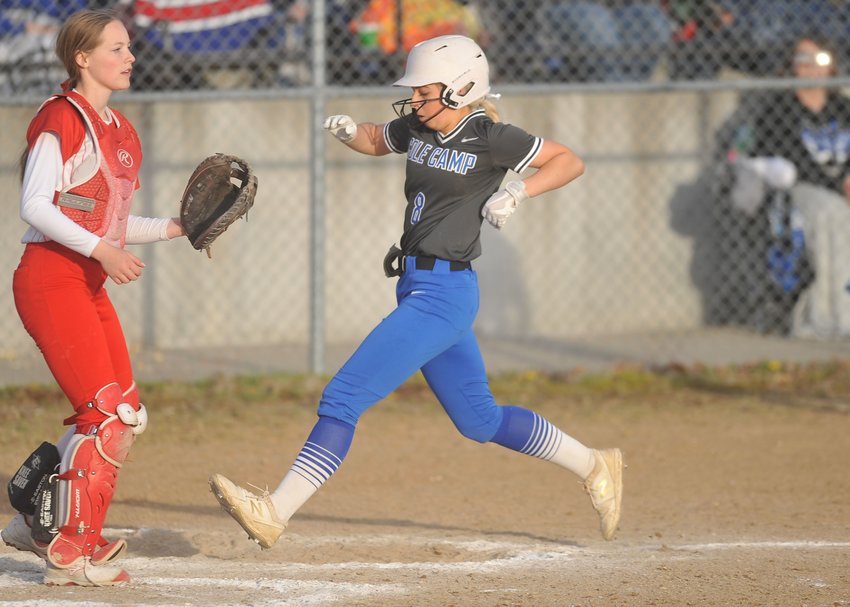 Infielder Emily Burke crosses home plate for a Cole Camp run in Saturday's Kaysinger Conference Softball Tournament Championship at Lincoln.