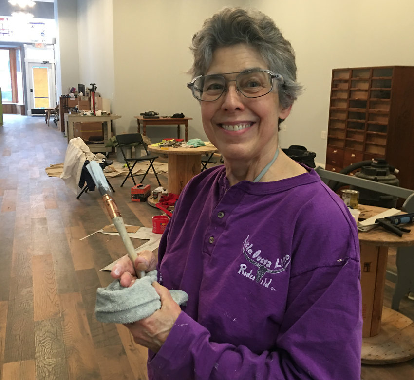 Anita Barrick, seen Wednesday, puts finishing touches on Happiness Handicrafts, the South Ohio Avenue shop due to open in mid-May.