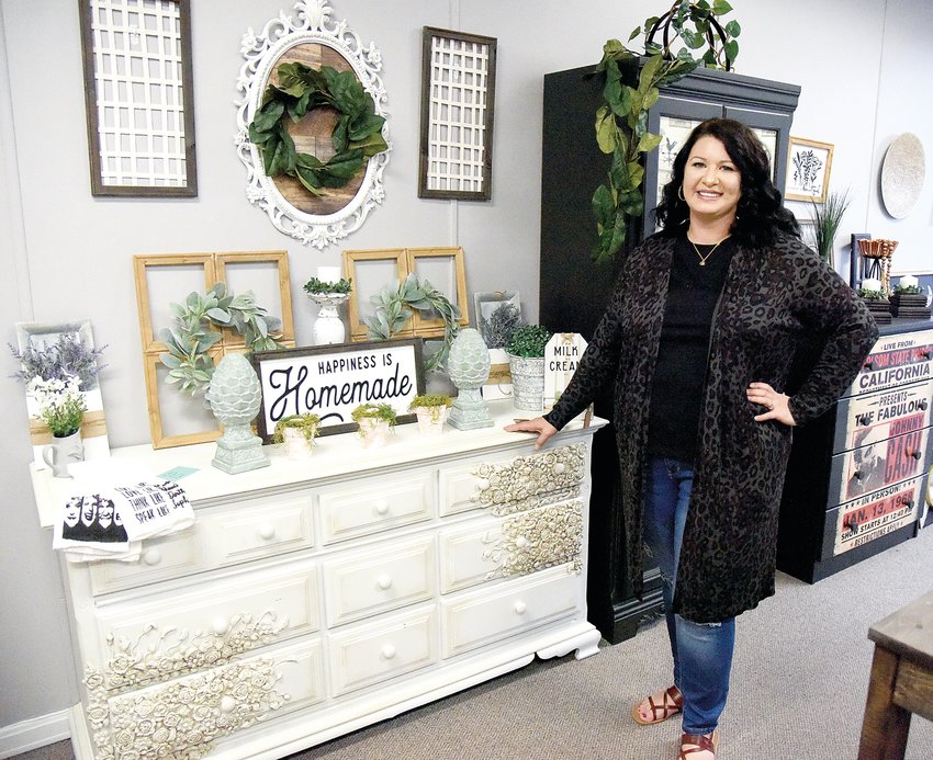 Nicki Rice stands in her newly reopened downtown shop, Bleak to Chic LLC, on Friday morning. Rice previously operated the shop in Hughesville. Bleak to Chic, specializing in handcrafted home d&eacute;cor, hosted an open house Friday. It is located at 106 W. Seventh St.